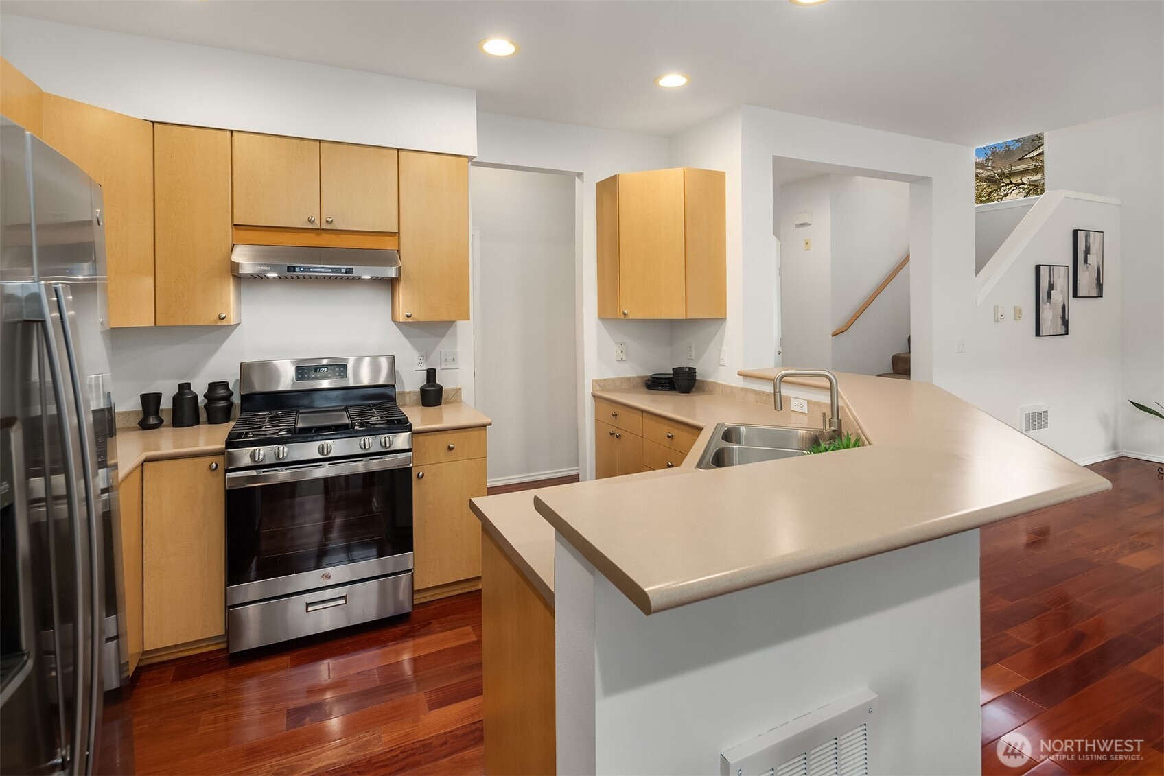 325 South 51st Street, Unit A Renton, WA 98055 - Photo 12 of 39 a kitchen with a sink a stove and a refrigerator