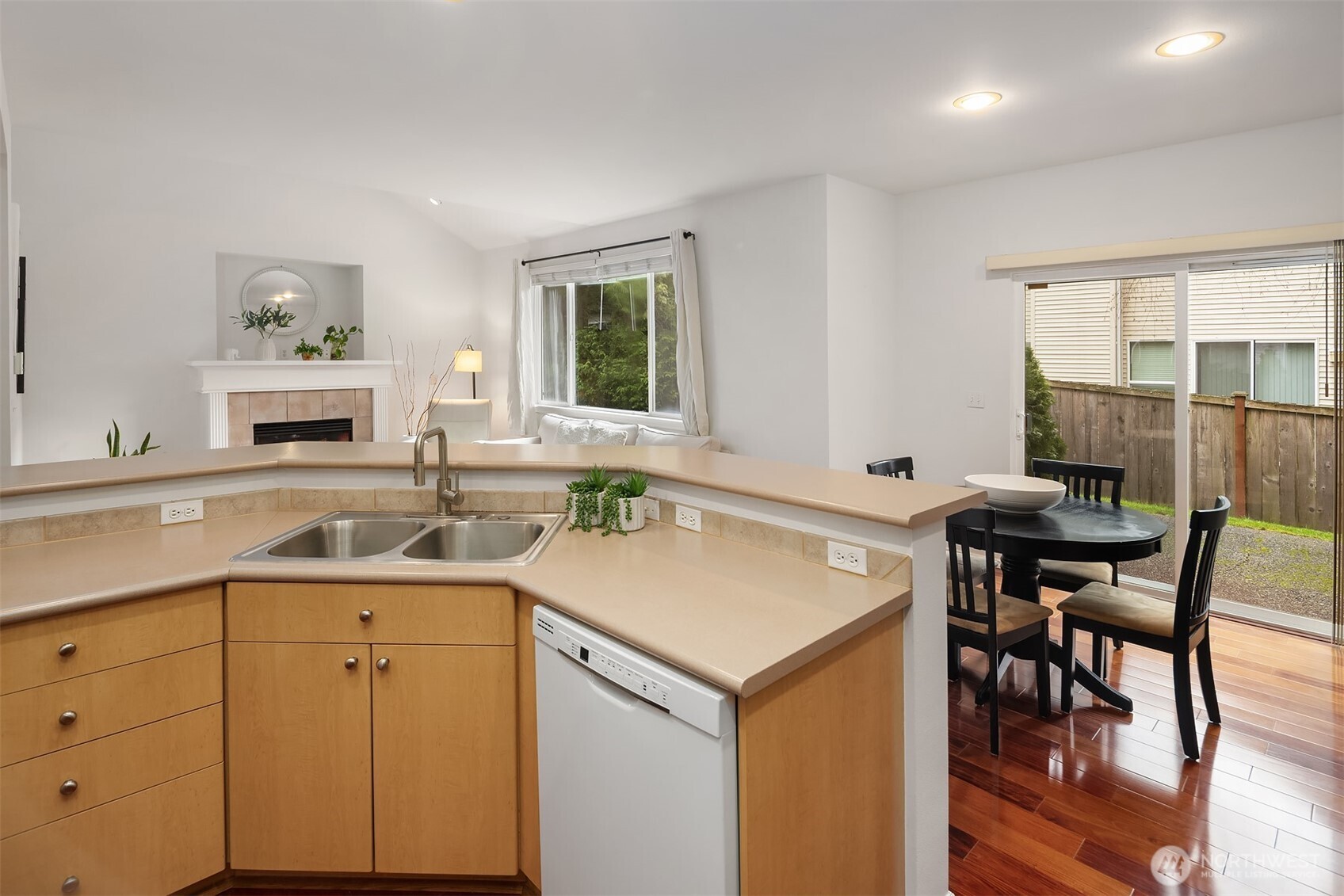 325 South 51st Street, Unit A Renton, WA 98055 - Photo 16 of 39 a view of a kitchen area with furniture and wooden floor