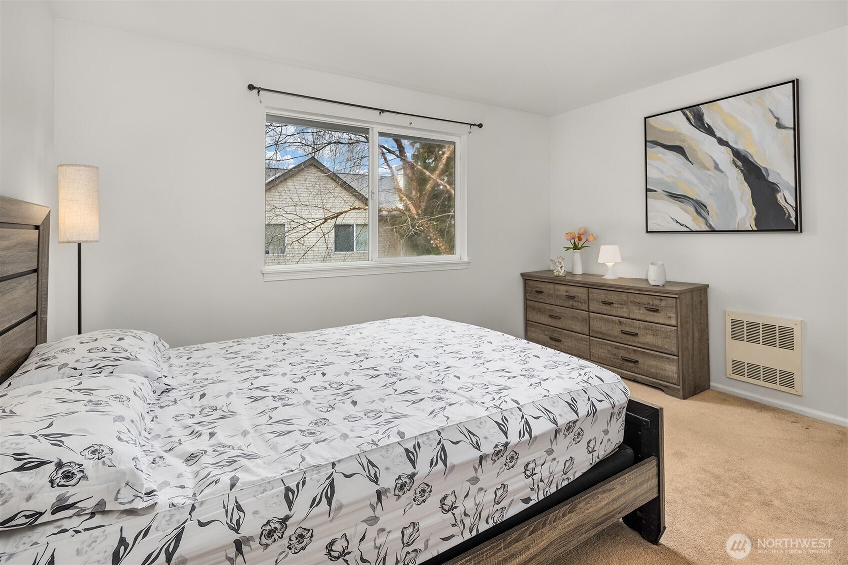 325 South 51st Street, Unit A Renton, WA 98055 - Photo 19 of 39 a bedroom with a bed and a painting on the wall