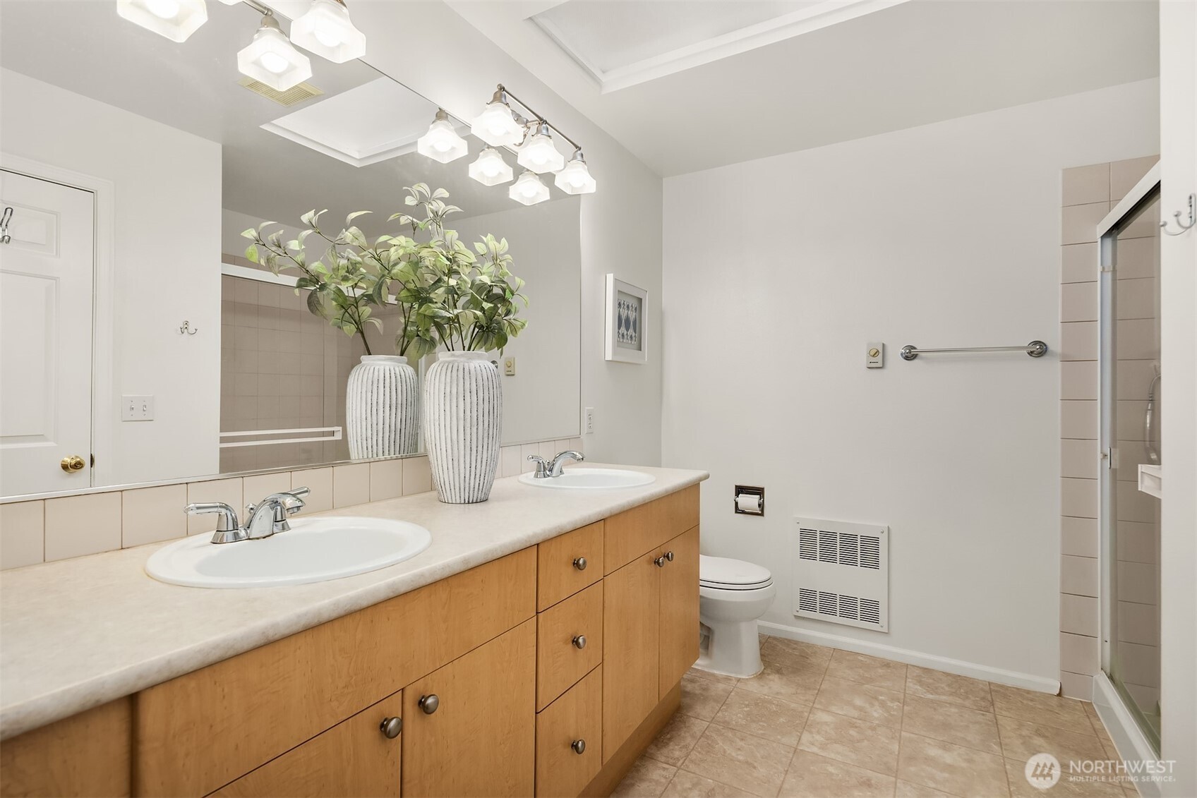 325 South 51st Street, Unit A Renton, WA 98055 - Photo 20 of 39 a bathroom with a granite countertop sink a toilet and mirror