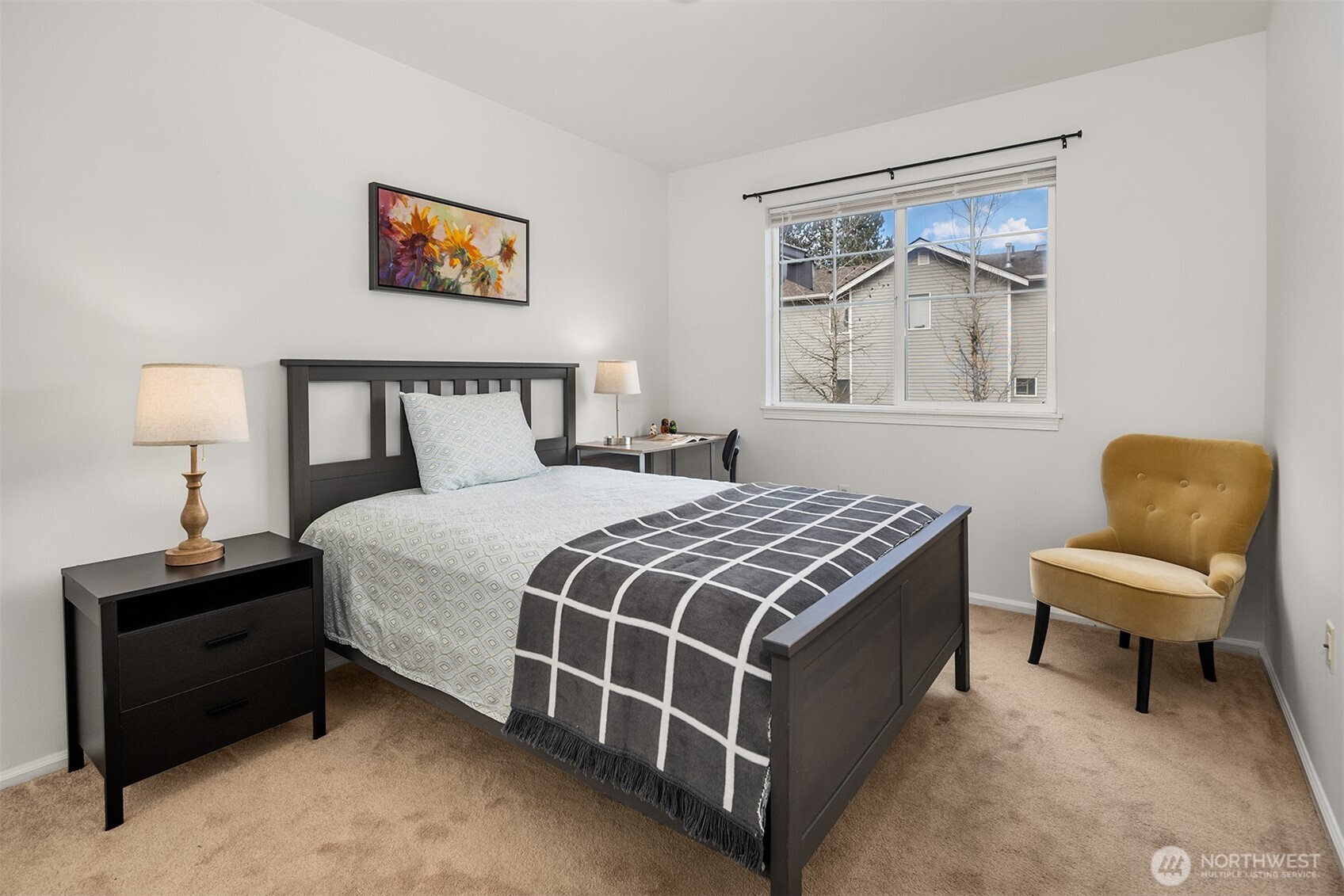 325 South 51st Street, Unit A Renton, WA 98055 - Photo 22 of 39 a bedroom with a bed and lamp