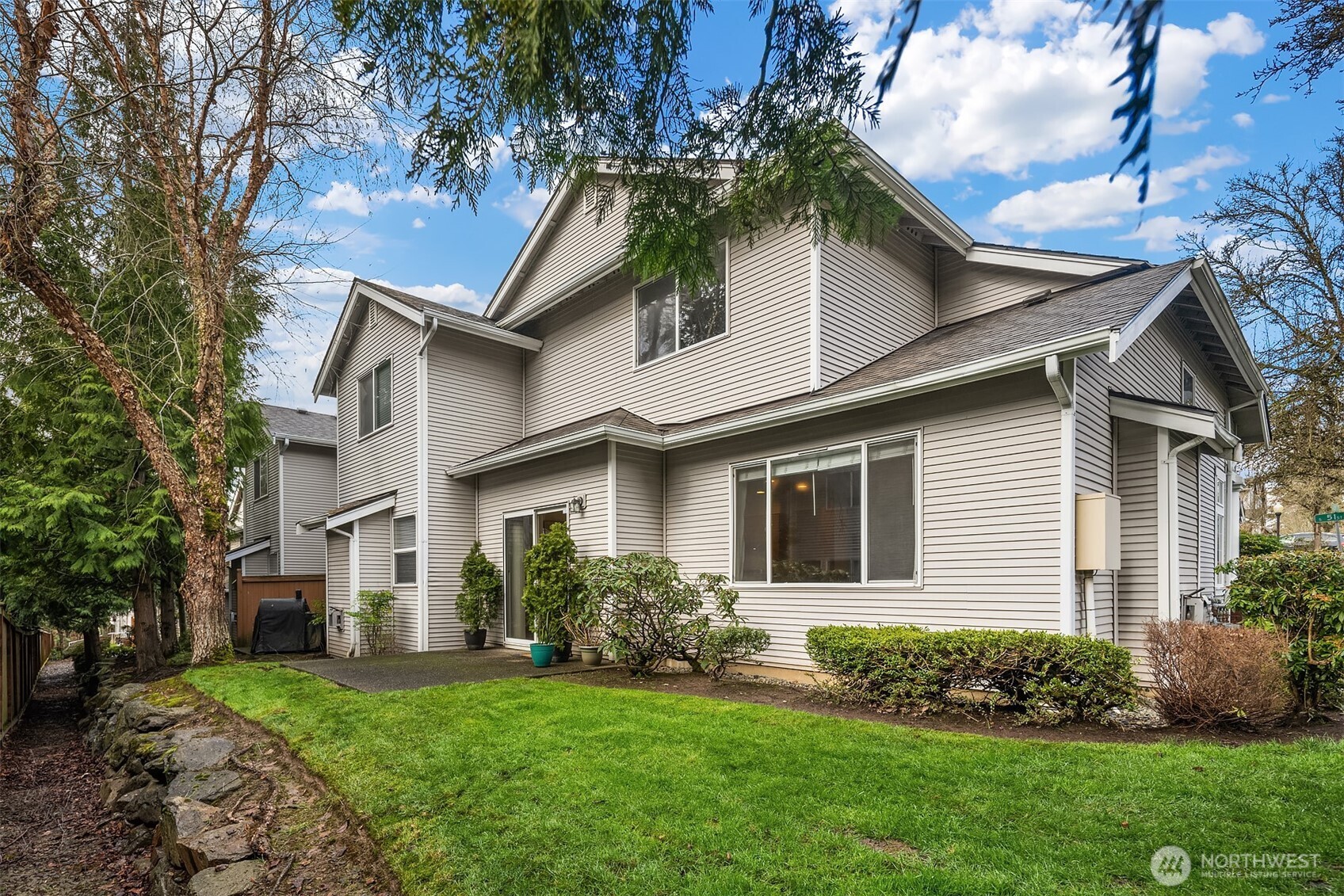 325 South 51st Street, Unit A Renton, WA 98055 - Photo 3 of 39 a front view of a house with a garden and plants