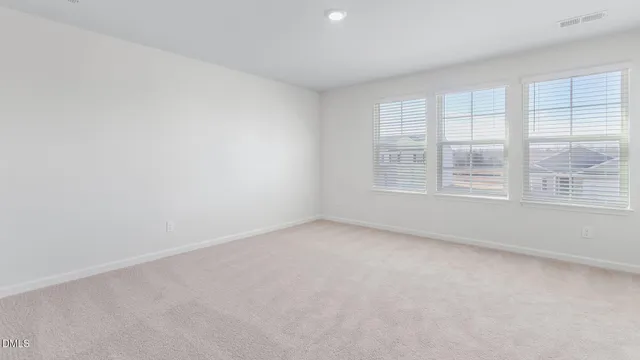 a view of a terrace that has white walls