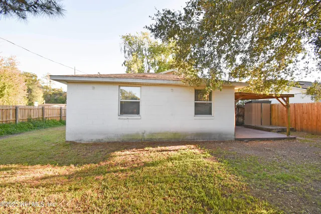a backyard of a house with lots of green space
