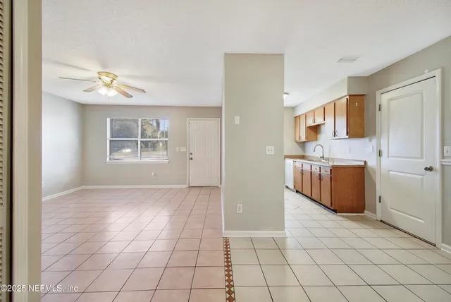 a kitchen with stainless steel appliances granite countertop a sink and dishwasher with cabinets