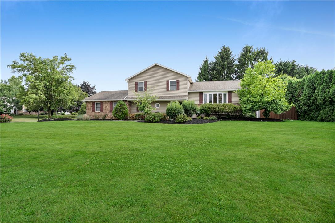3396 Darien Road Bethlehem, PA 18020 - Photo 2 of 44 A classic two-story residence with a meticulously maintained front yard and mature landscaping.