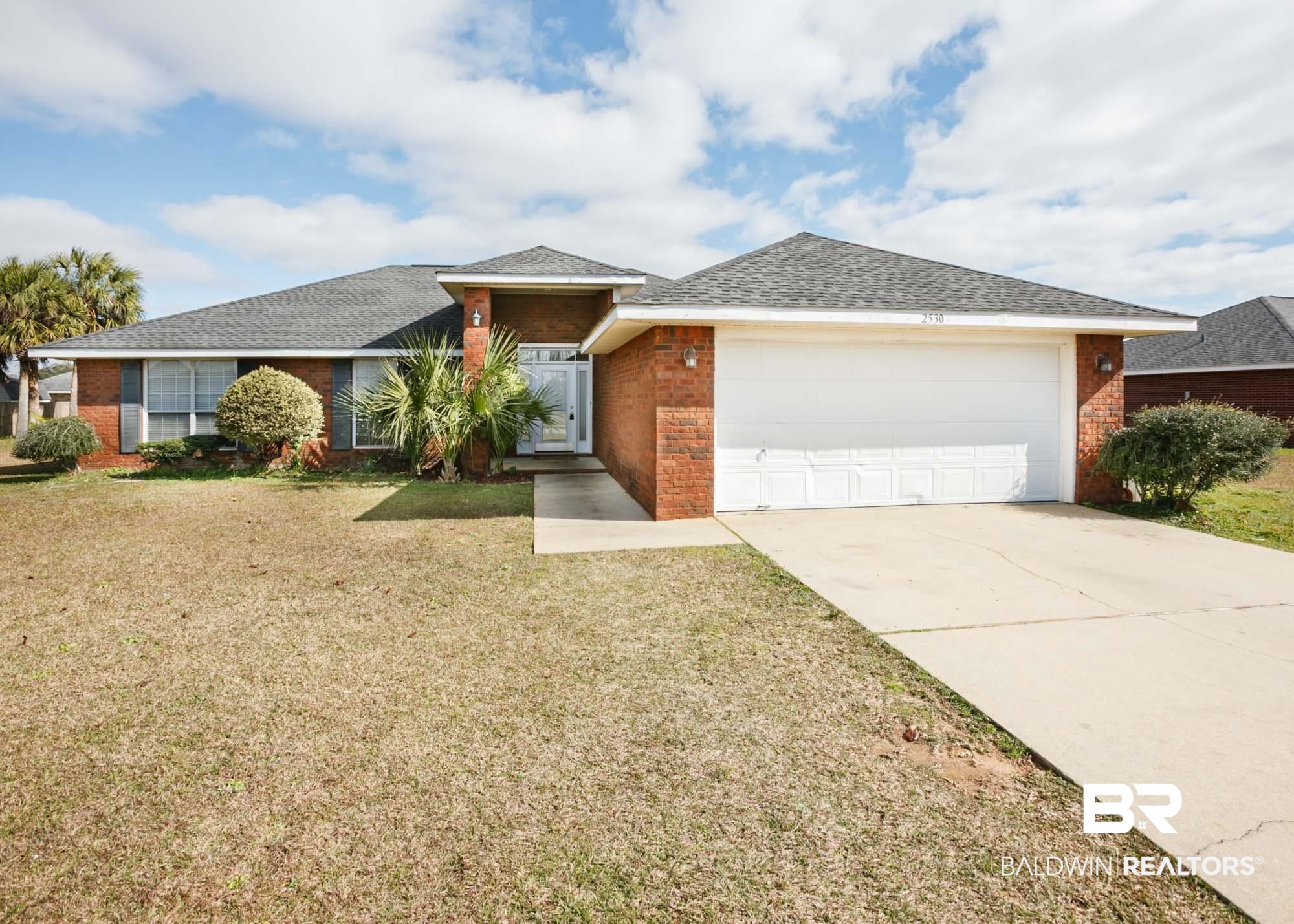 2530 Ashburn Lane Foley, AL 36535 - Photo 2 of 46 Ranch-style house featuring a garage and a front lawn