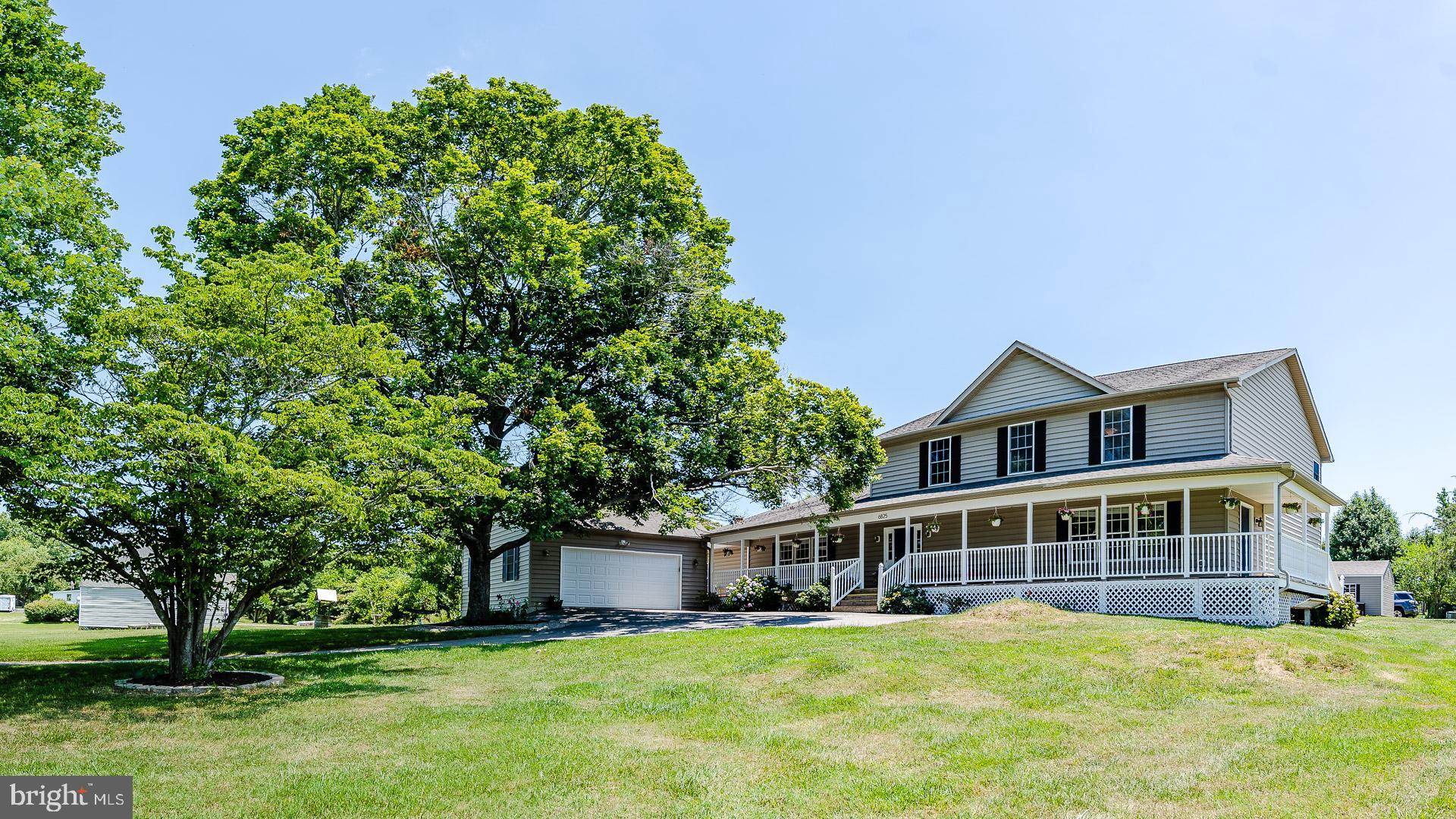 6825 Briscoe Turn Road Owings, MD 20736 - Photo 39 of 47 a view of a house with a yard