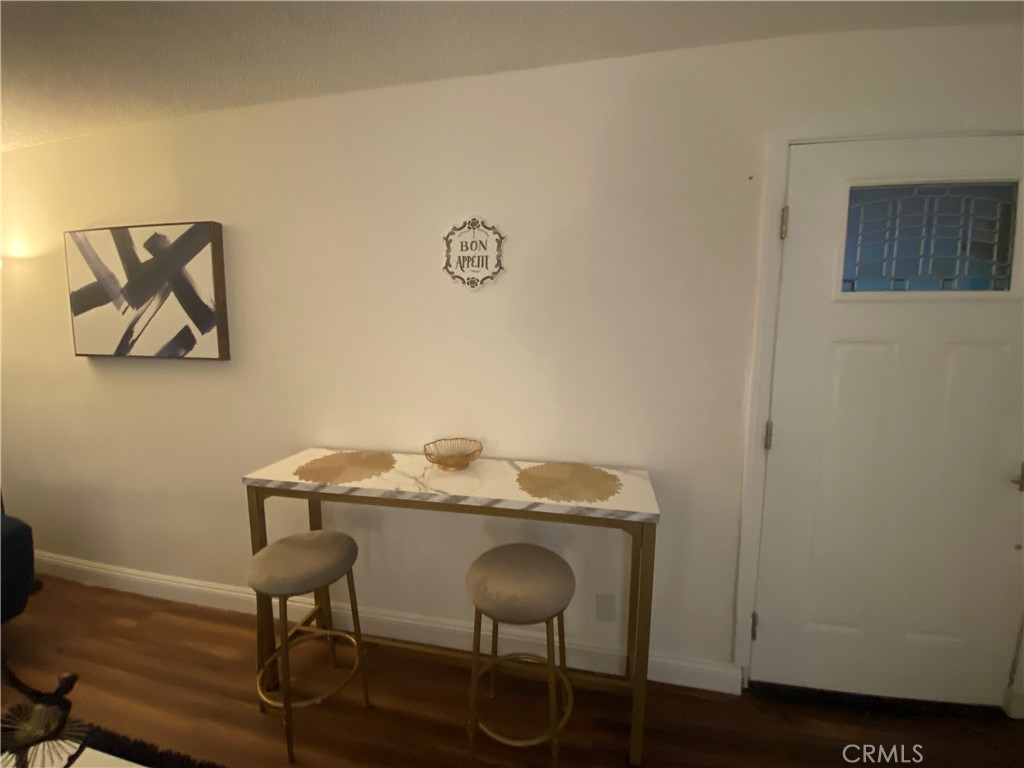 3112 W Avenue North, Unit F Palmdale, CA 93551 - Photo 3 of 5 a view of a workspace with furniture