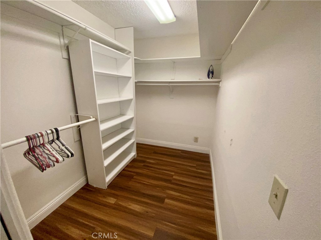 3112 W Avenue North, Unit F Palmdale, CA 93551 - Photo 4 of 5 a view of walk in closet with empty racks