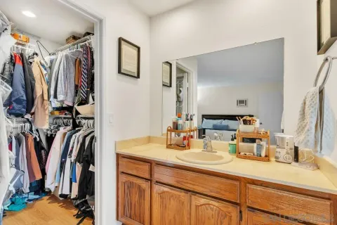 a bathroom with a shower and a sink