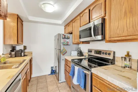 a kitchen with a stove and a sink