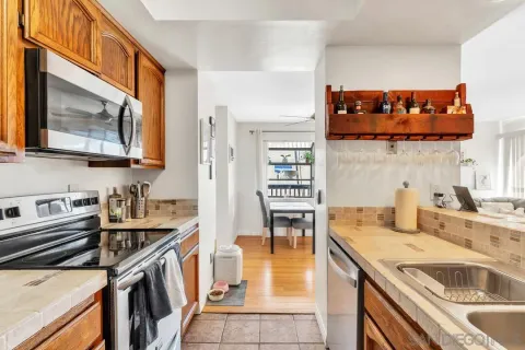 a kitchen with stainless steel appliances granite countertop a stove and a sink