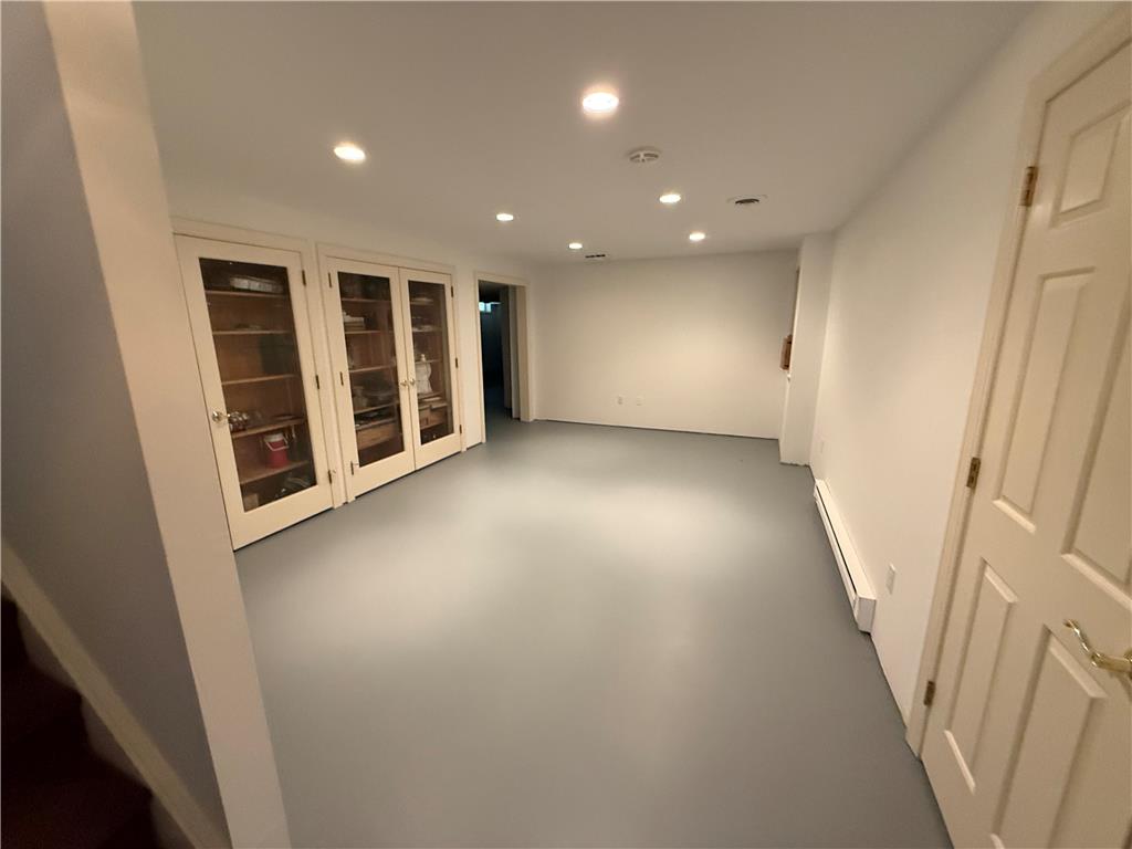 4114 Rochelle Drive Allentown, PA 18104 - Photo 32 of 35 Recessed lighting illuminates this versatile basement space, featuring practical built-in storage cabinets.