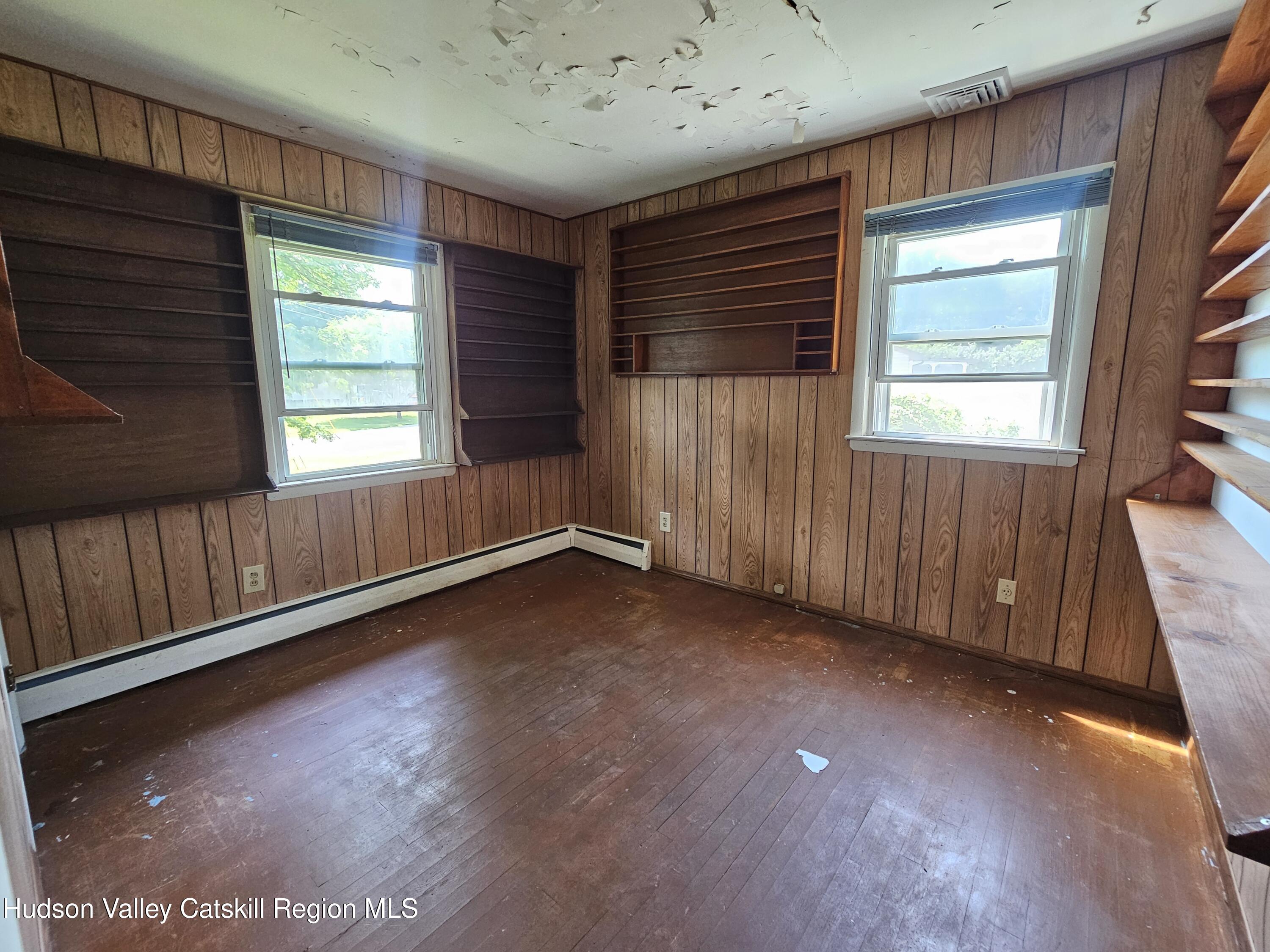 10 Amherst Road Red Hook, NY 12571 - Photo 7 of 20 a view of an empty room with wooden floor and a window