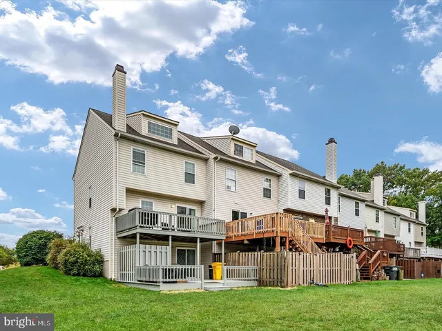 a view of house with yard and entertaining space