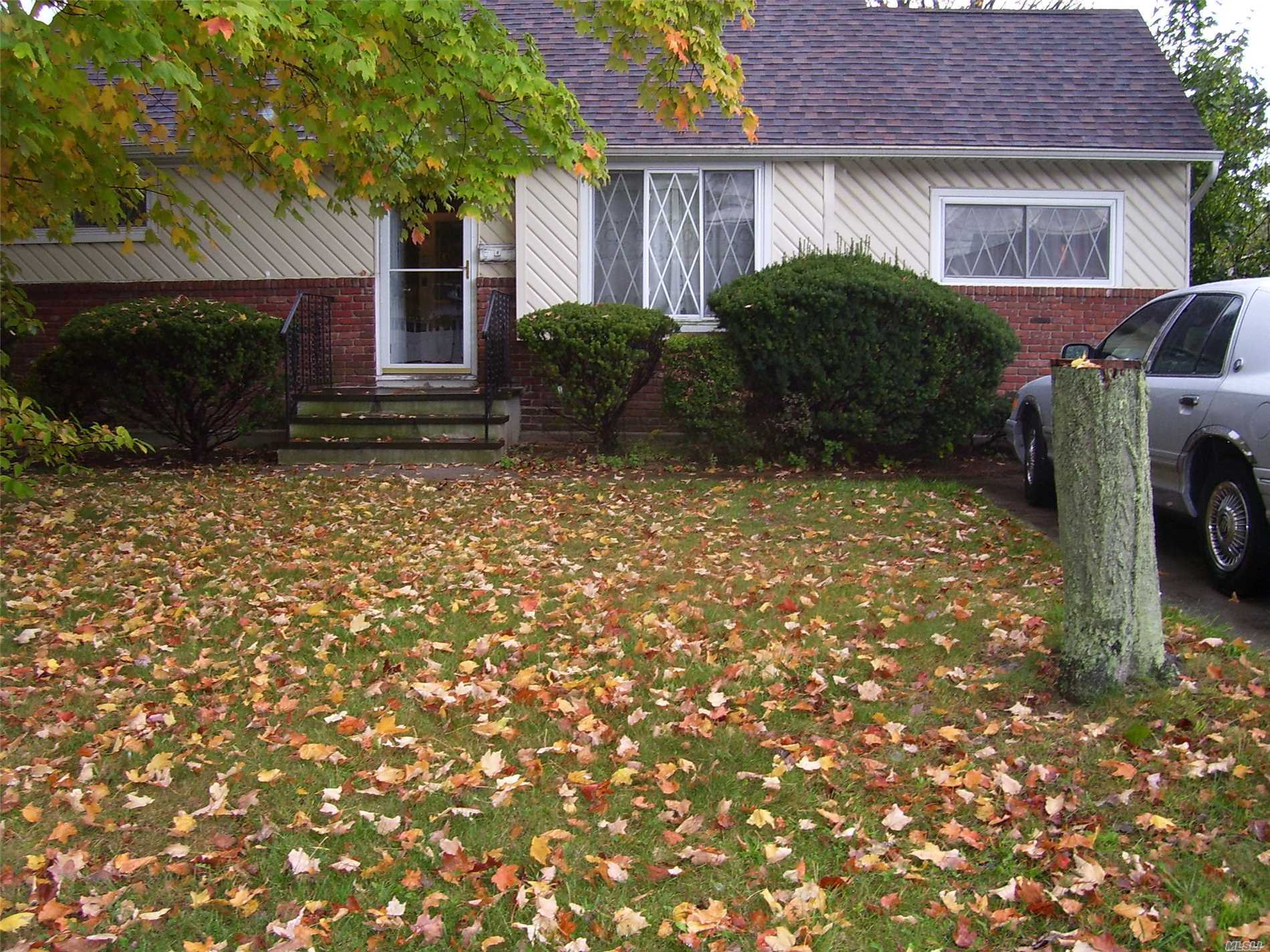 243 32nd Street Lindenhurst, NY 11757 - Photo 1 of 1 a view of a house with a yard