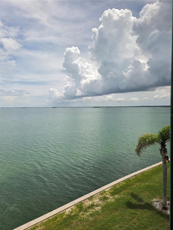 7 Dunoon Place, Unit 309 Dunedin, FL 34698 - Photo 8 of 25 a view of a lake from a yard