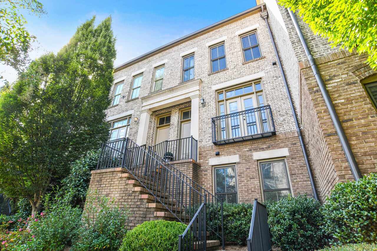 3566 Roswell Road, Unit 54 Atlanta, GA 30305 - Photo 1 of 1 a front view of a multi story residential apartment building with yard and entryway