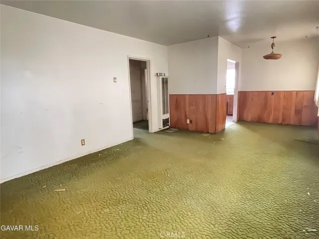 a kitchen with a stove sink and window