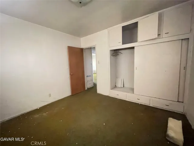 a view of garage and yard