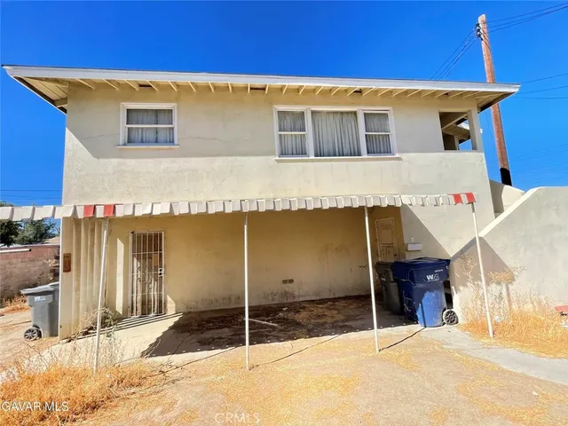 a view of a room with gym equipment and a window