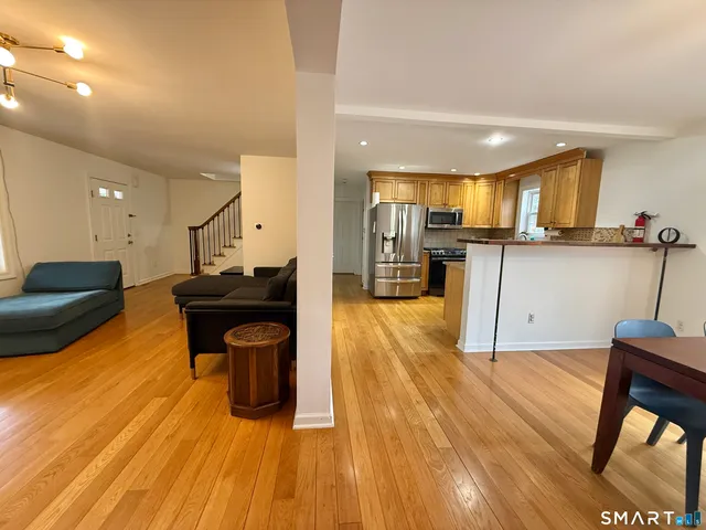 a kitchen with a sink appliances and cabinets