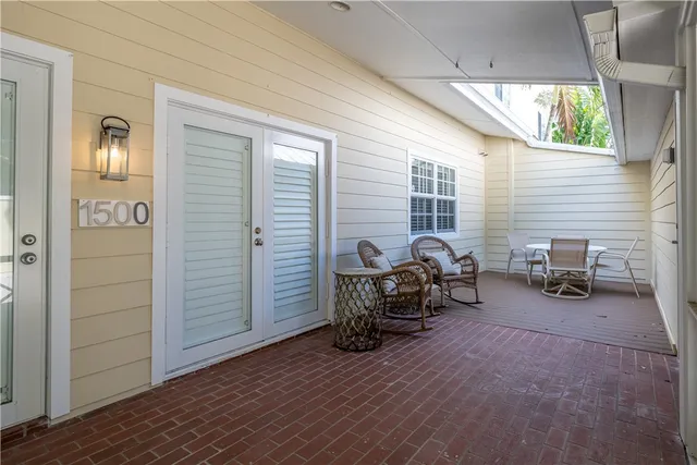 a view of a livingroom with chair and a couch