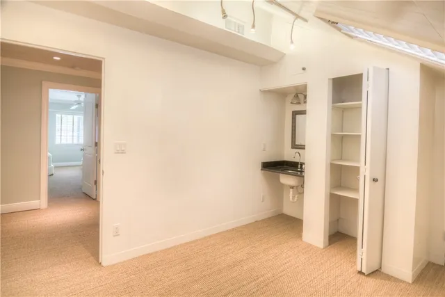 a view of empty room with a bathroom