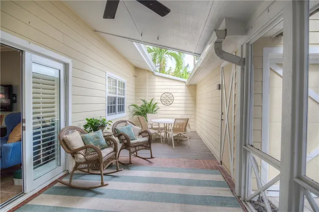 a view of two chairs in the balcony