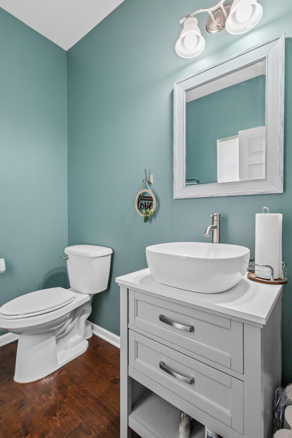 12938 Hayes Street Crown Point, IN 46307 - Photo 12 of 33 a bathroom with a toilet a sink and mirror