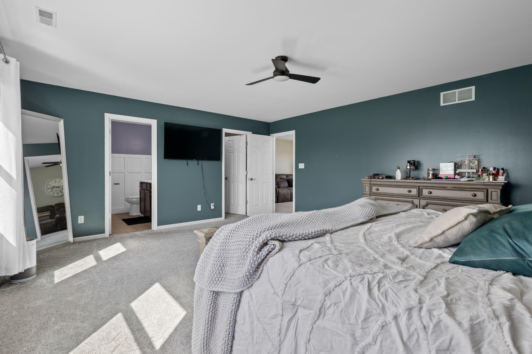 12938 Hayes Street Crown Point, IN 46307 - Photo 16 of 33 a bedroom with a bed and a chandelier