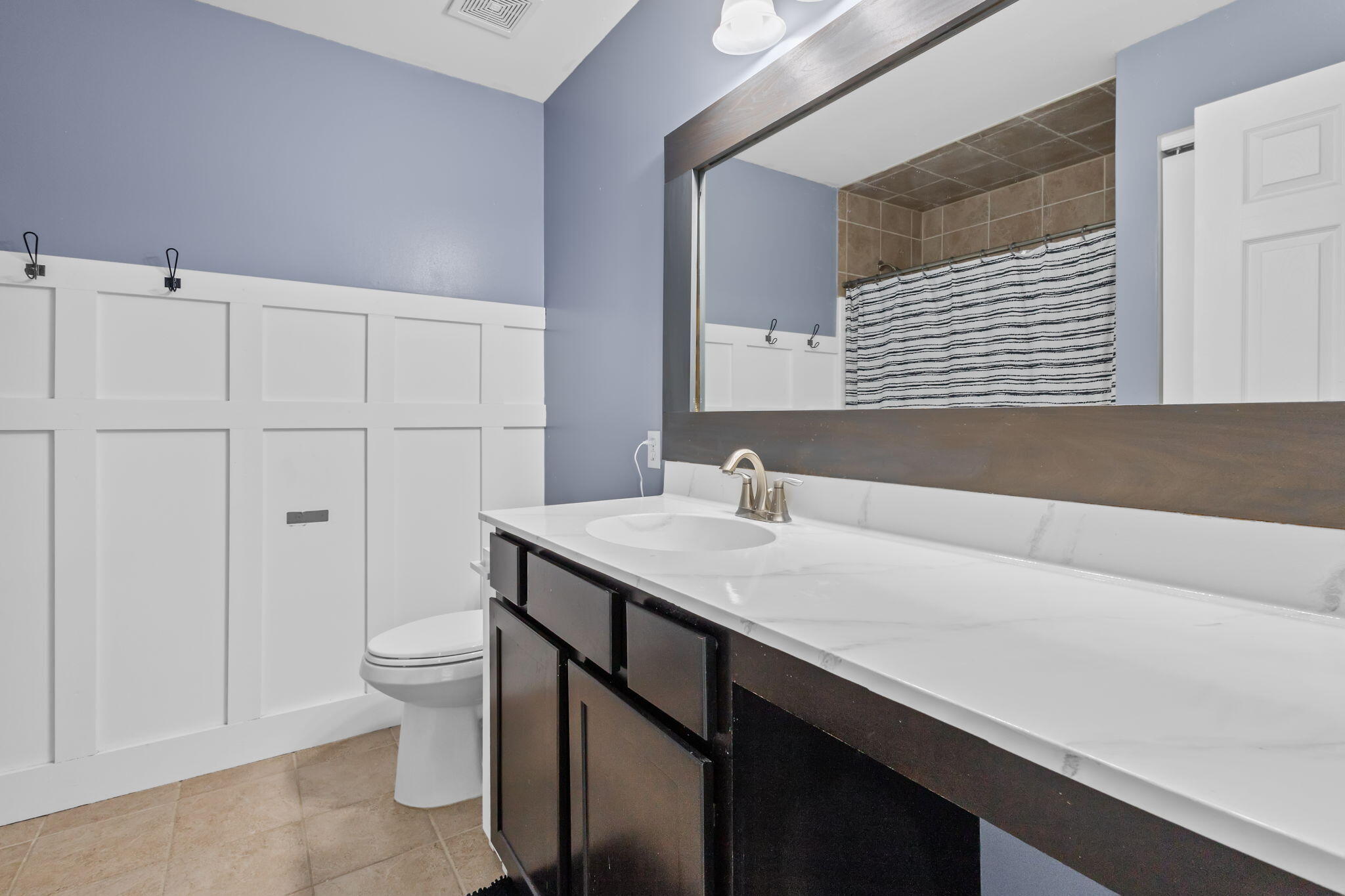 12938 Hayes Street Crown Point, IN 46307 - Photo 17 of 33 a bathroom with a sink and a toilet