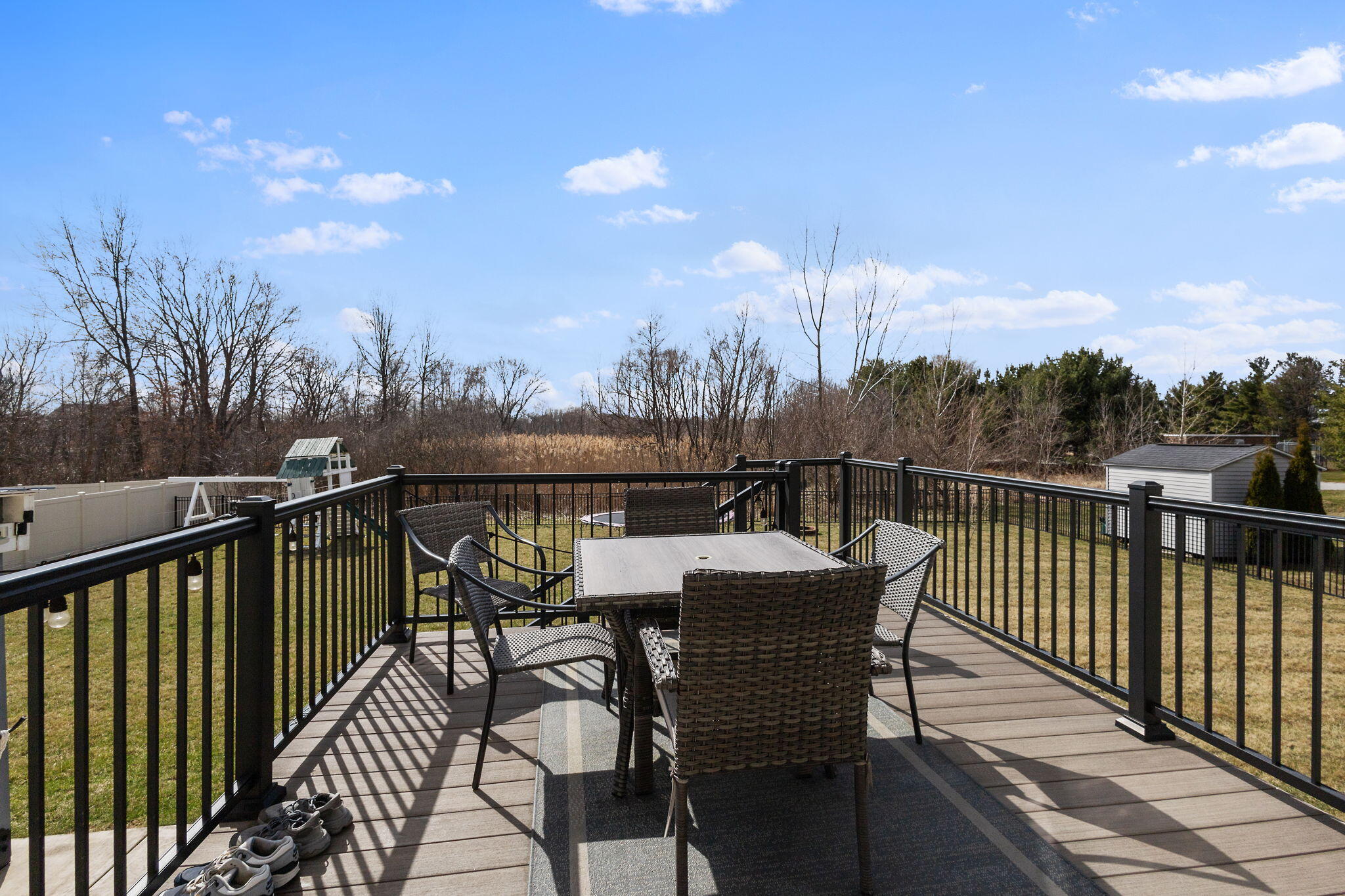 12938 Hayes Street Crown Point, IN 46307 - Photo 24 of 33 a view of a balcony with wooden floor and iron fence