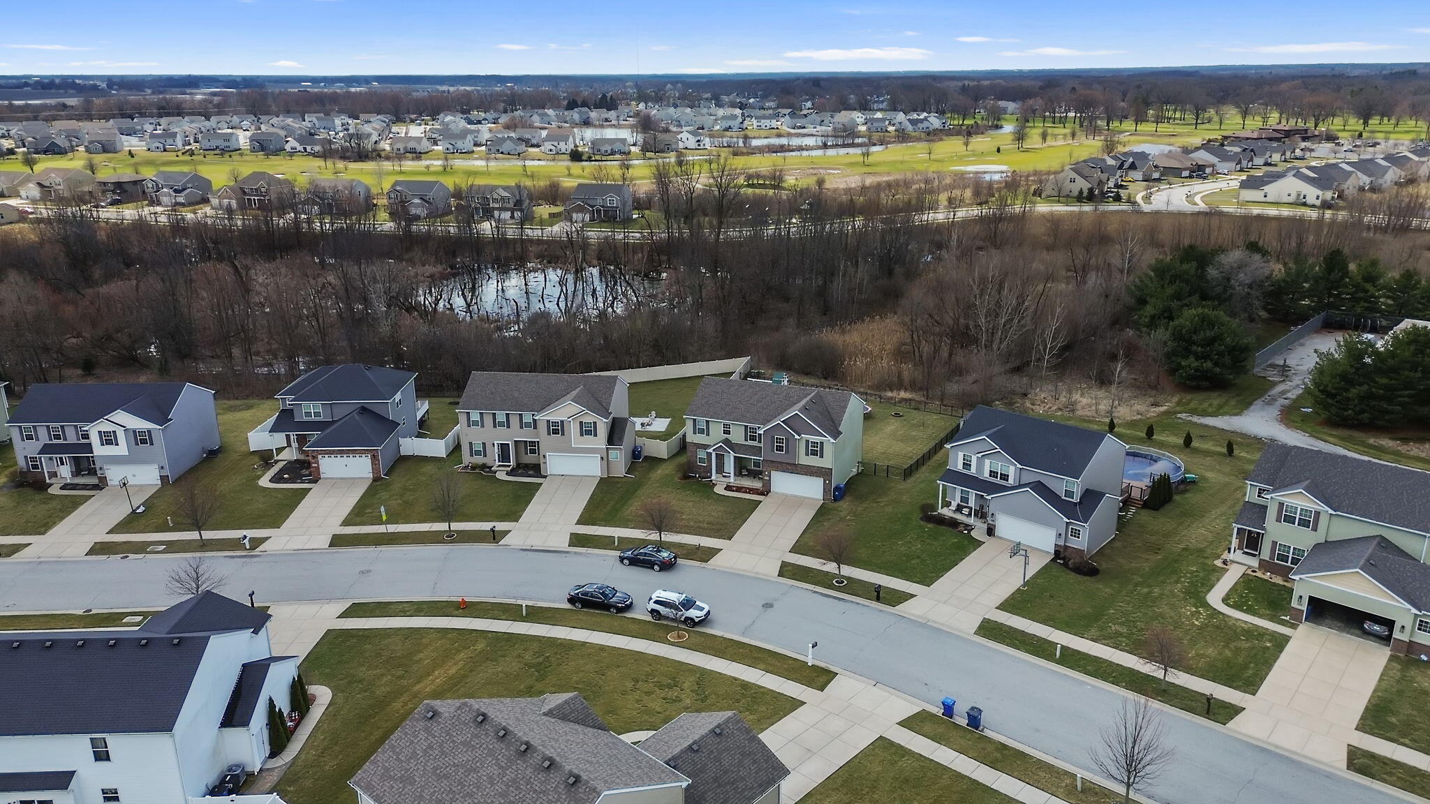12938 Hayes Street Crown Point, IN 46307 - Photo 29 of 33 a view of swimming pool with a table and chairs