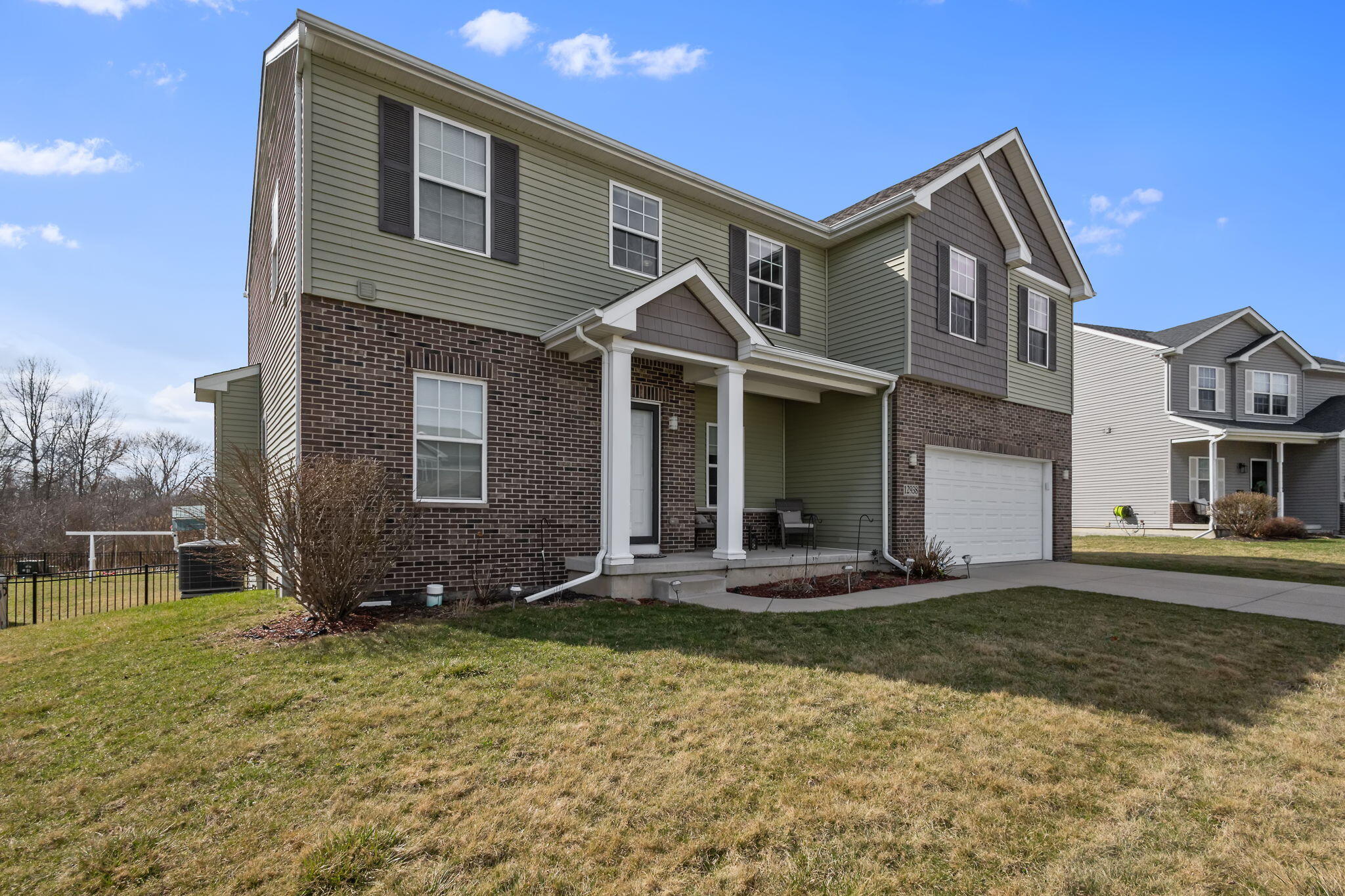12938 Hayes Street Crown Point, IN 46307 - Photo 32 of 33 a front view of a house with a yard