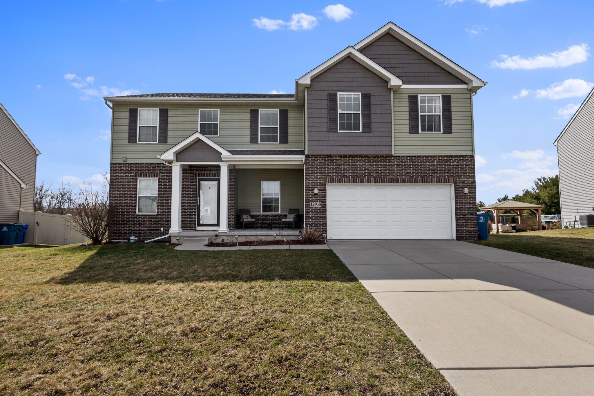 12938 Hayes Street Crown Point, IN 46307 - Photo 33 of 33 a front view of a house with a yard