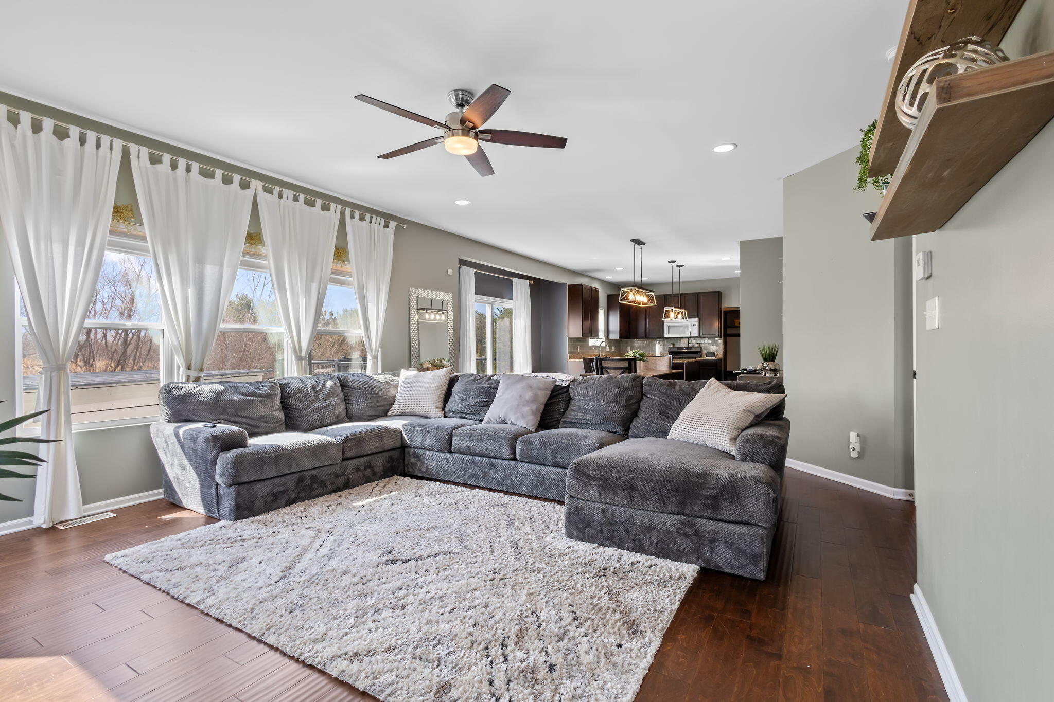 12938 Hayes Street Crown Point, IN 46307 - Photo 6 of 33 a living room with furniture and a large window