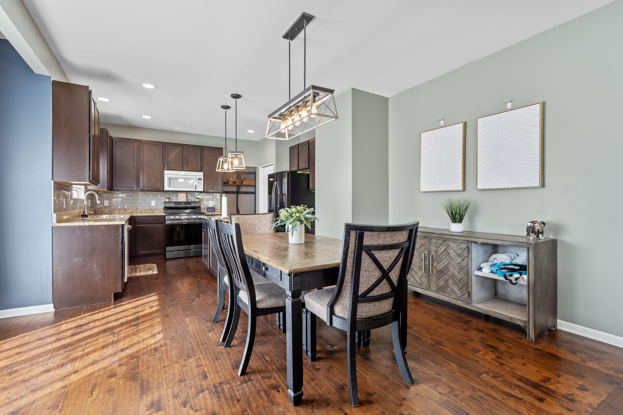 12938 Hayes Street Crown Point, IN 46307 - Photo 7 of 33 a view of a dining room with furniture and wooden floor