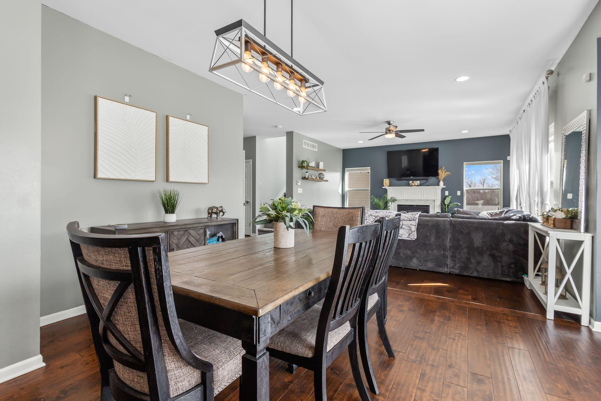 12938 Hayes Street Crown Point, IN 46307 - Photo 8 of 33 a view of a dining room with furniture and wooden floor