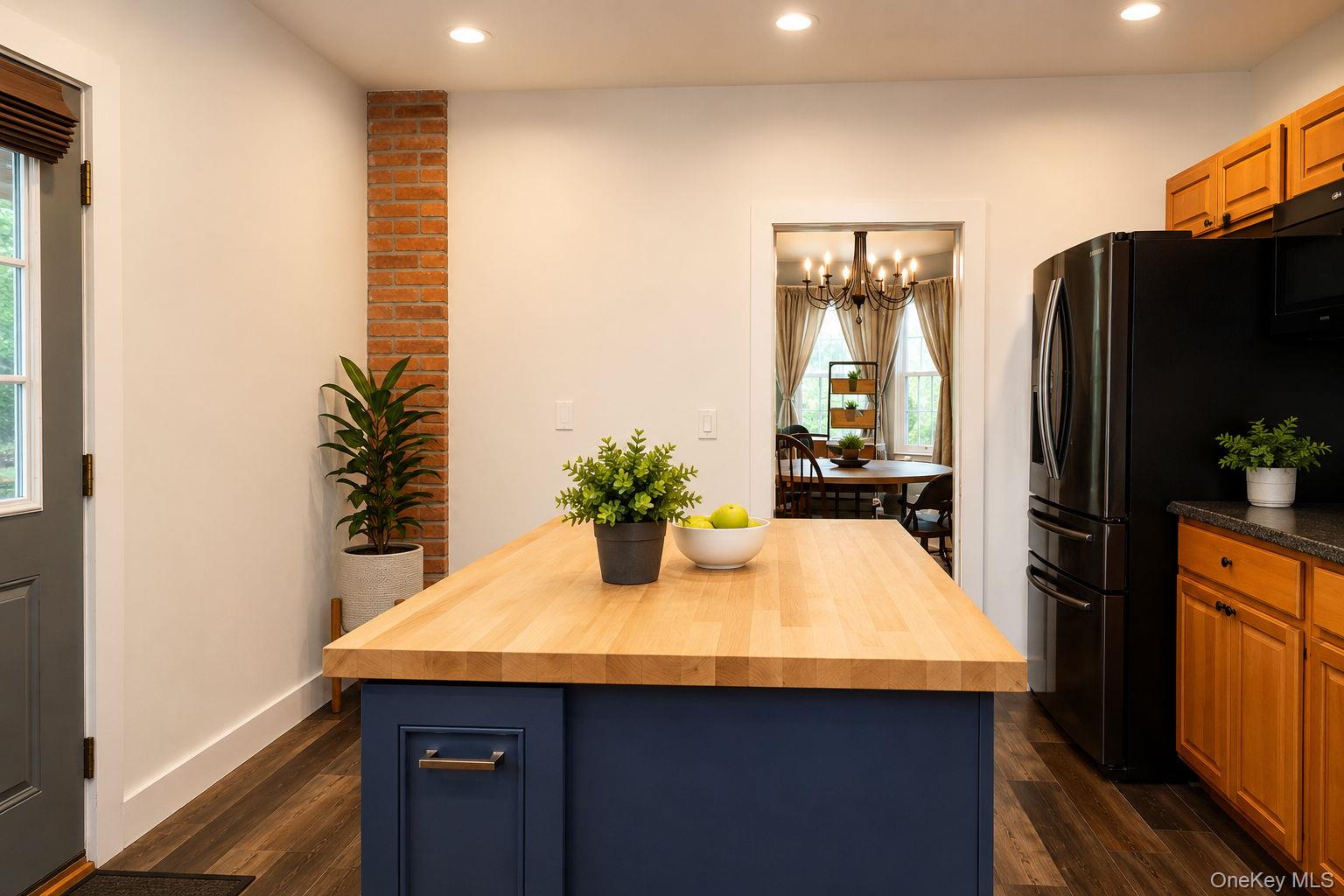 340 Dunn Road Montgomery, NY 12549 - Photo 10 of 34 Butcher block island with view into the formal dinning room and wall features exposed brick