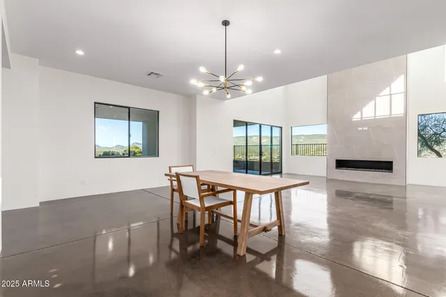 a spacious bedroom with a bed and a window