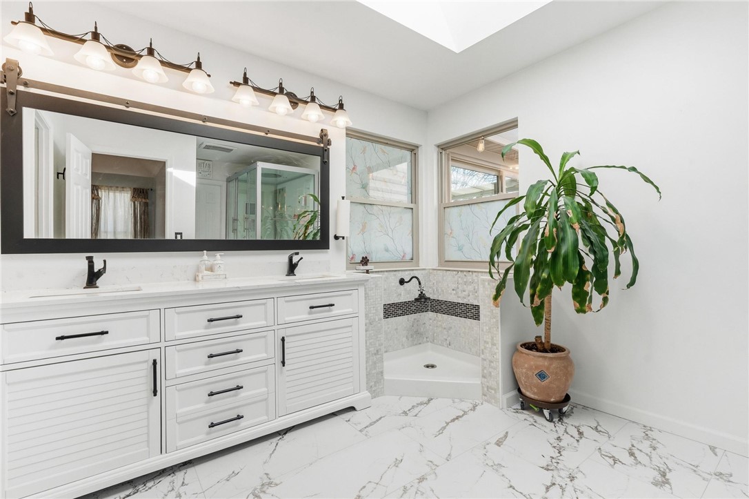 8781 Rupp Farm Drive West Chester, OH 45069 - Photo 33 of 48 This serene primary bathroom offers dual vanities and a spacious walk-in shower.