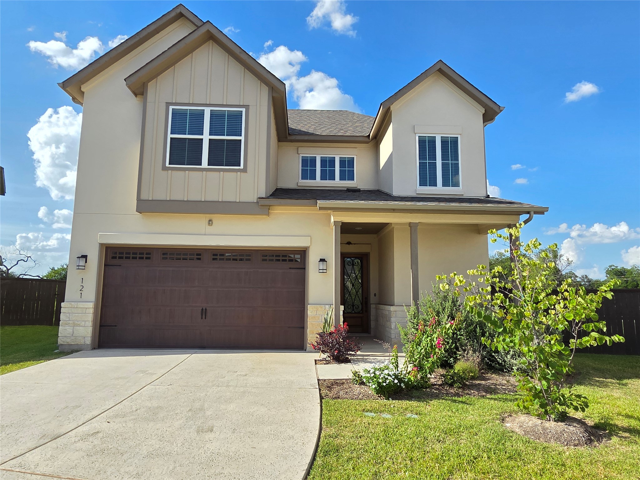 600 C-Bar Ranch Trail, Unit 121 Cedar Park, TX 78613 - Photo 4 of 32 A cream-colored residence with a welcoming front entrance and meticulously maintained landscaping.
