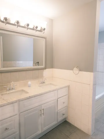 a bathroom with a sink and vanity