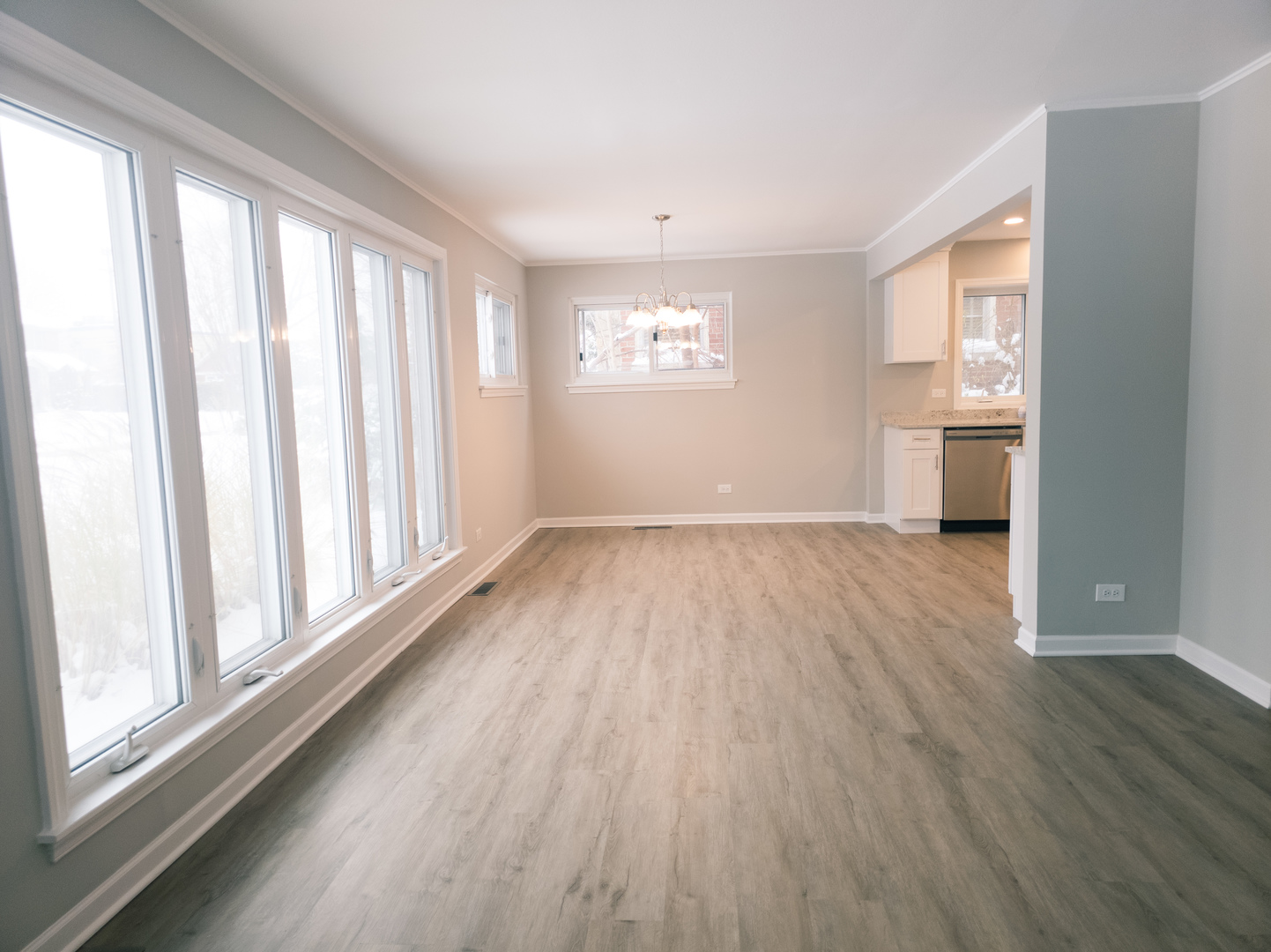 1904 South Fairview Avenue Park Ridge, IL 60068 - Photo 2 of 18 a view of an empty room with wooden floor and a window