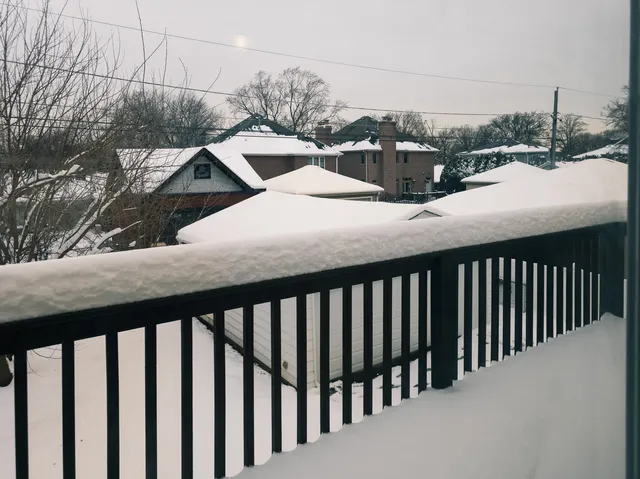 a view of a balcony with wooden floor