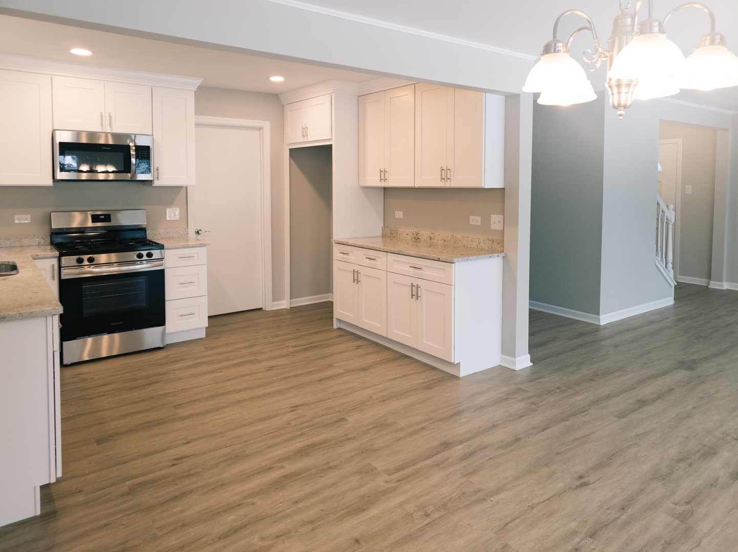 1904 South Fairview Avenue Park Ridge, IL 60068 - Photo 9 of 18 a kitchen with granite countertop a refrigerator and a stove top oven