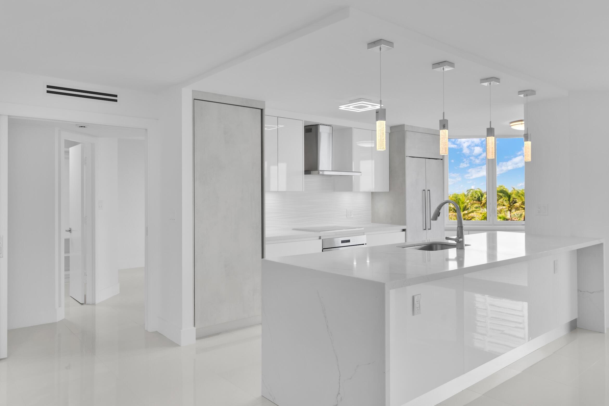 550 South Ocean Boulevard, Unit 403 Boca Raton, FL 33432 - Photo 1 of 55 a kitchen with stainless steel appliances granite countertop white cabinets and a granite counter tops