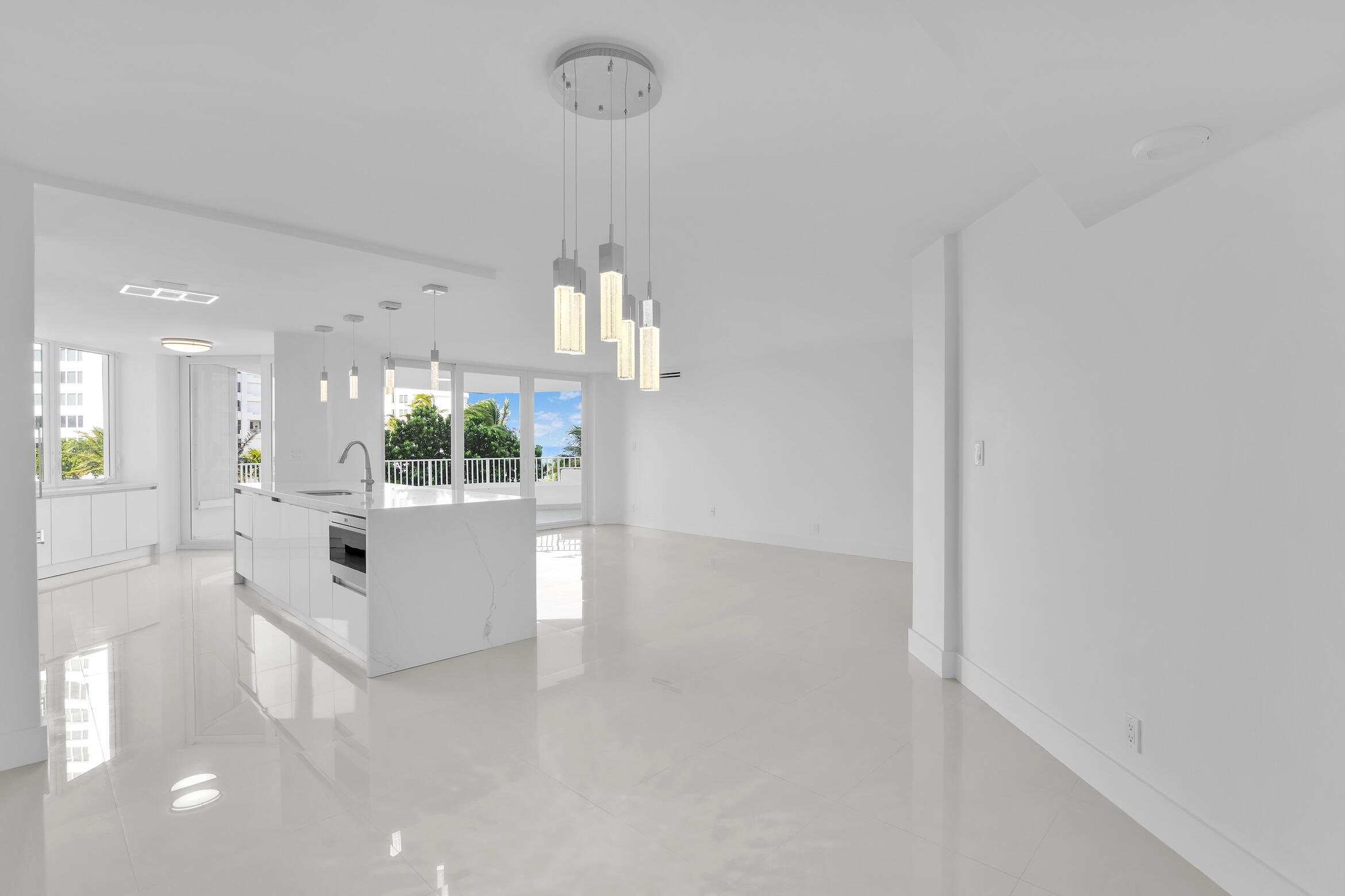 550 South Ocean Boulevard, Unit 403 Boca Raton, FL 33432 - Photo 12 of 55 a view of kitchen with refrigerator and window